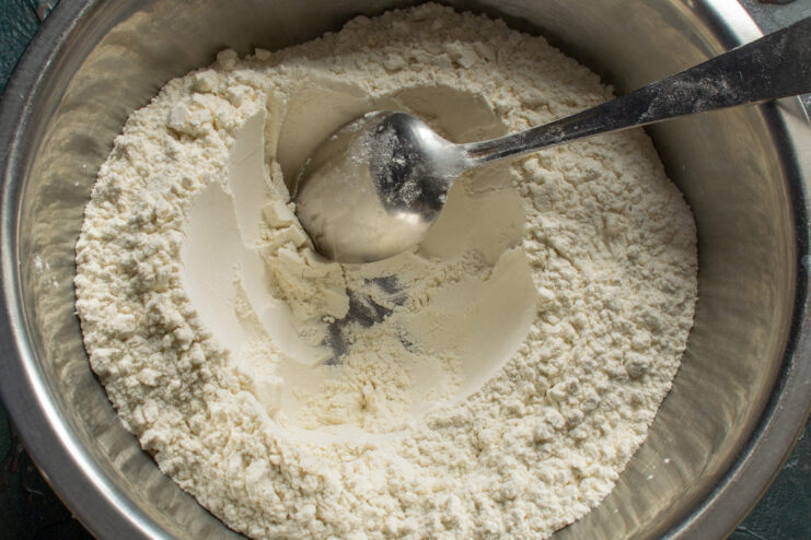 Wheat flour measured in a deep bowl for making khinkali dough