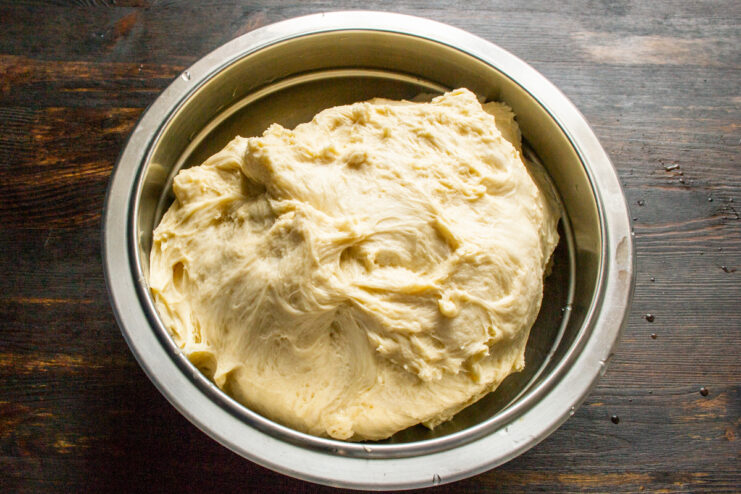 Proofing the Yeast Dough Fluffy yeast dough resting in a bowl after proofing
