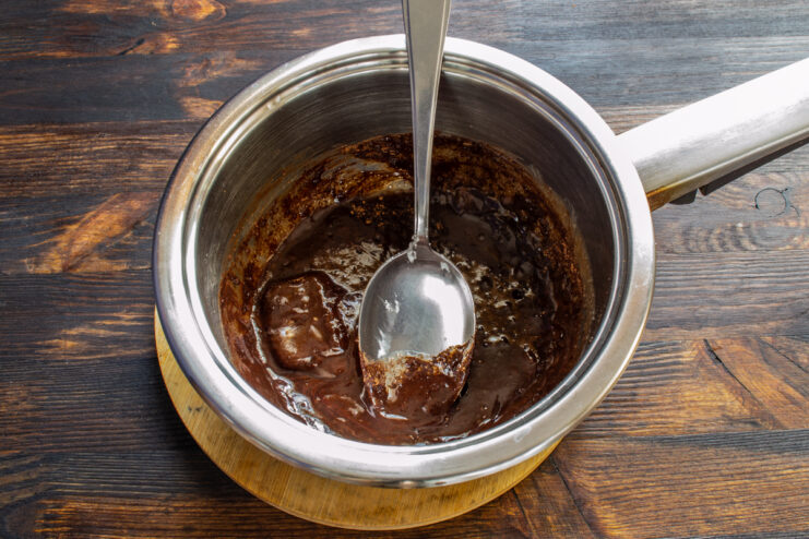 Making the Chocolate Glaze Melting chocolate and sour cream in a saucepan
