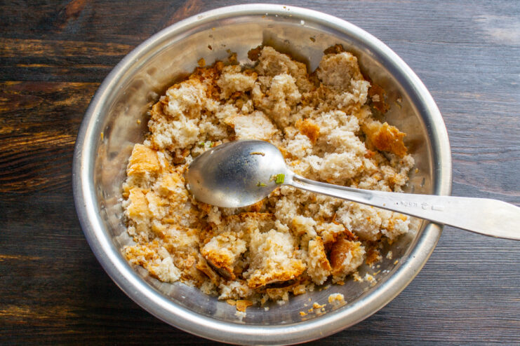 Preparing the bread Soaked whole wheat bread in a metal mixing bowl