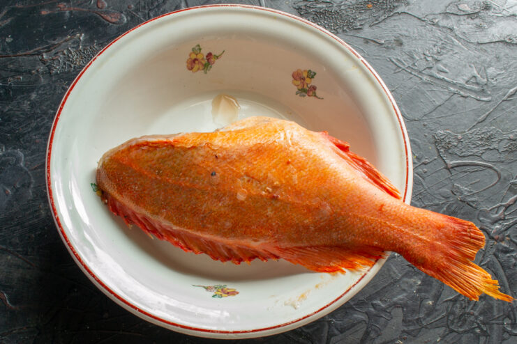 Thawing the Fish Thawed whole ocean perch resting in a bowl