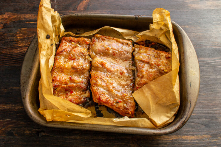 Glazed ribs ready for the broiler Honey-glazed pork ribs in a baking dish right before the final broil.