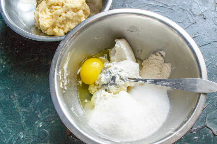 Mixing ricotta filling ingredients Ricotta, sugar, egg, and vanilla in a bowl