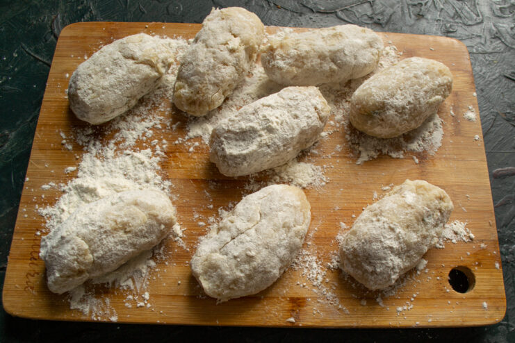 Dredging in Flour Stuffed fish patties generously coated in white flour