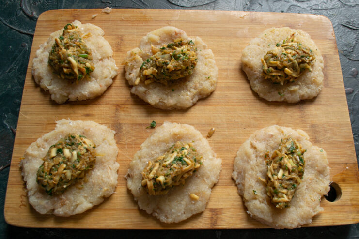 Stuffing the Patties Fish patties topped with an egg and onion filling