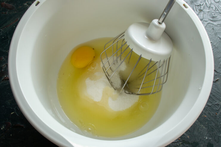 Preparing the ingredients Sugar and eggs in a stand mixer bowl