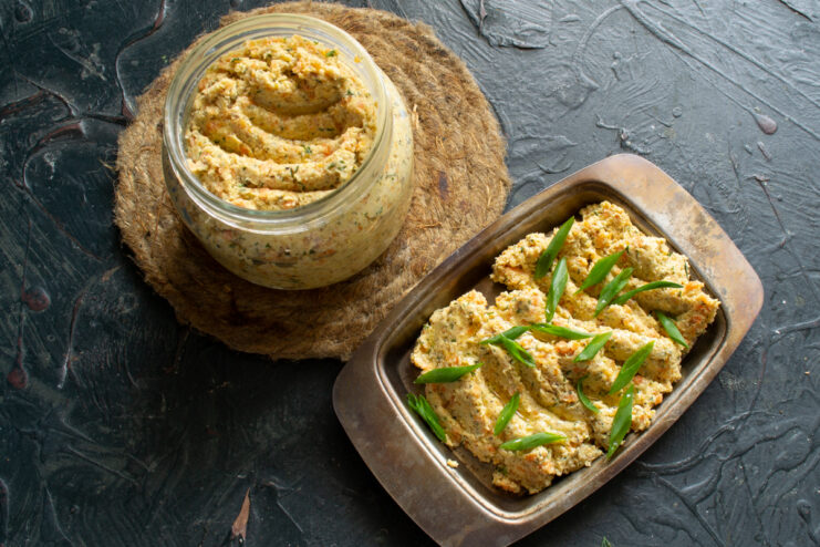 Serving chicken pate Serving chicken pate with chopped fresh scallions on a rustic metal platter