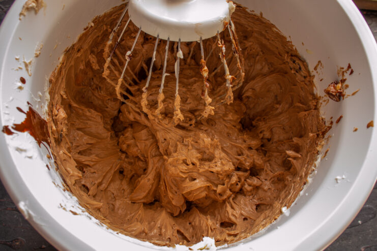 Preparing The Chocolate Cream Thick chocolate and mascarpone cream whipped inside a mixer bowl