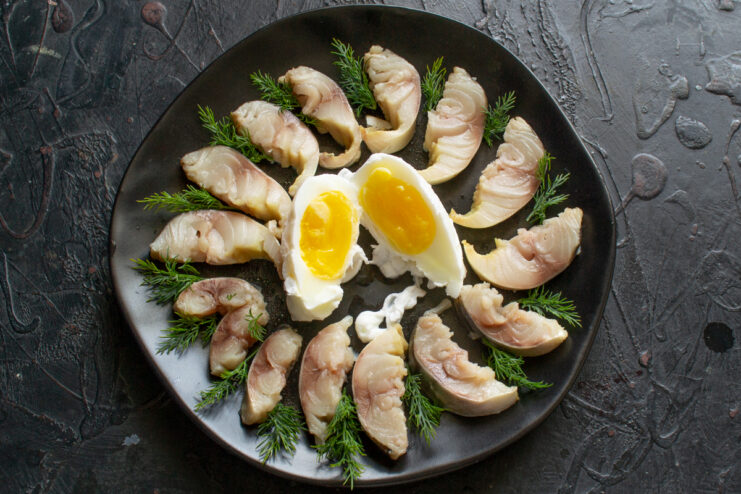 Mackerel With A Poached Egg Mackerel with dill and a halved poached egg in the center