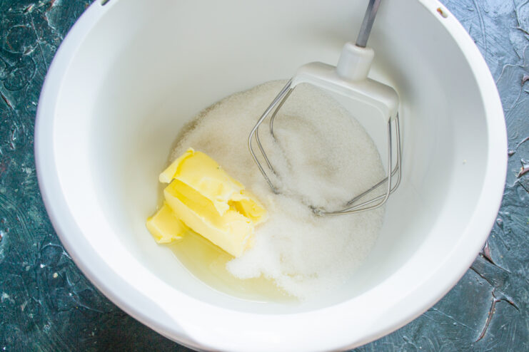 Mixing butter and sugar Butter, oil, and sugar mixed in a stand mixer bowl