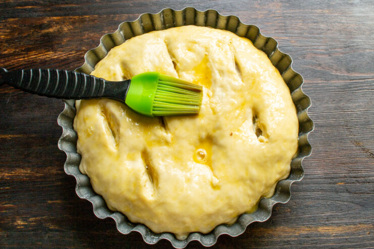 Applying the Egg Wash Brushing the surface of a pie with beaten egg using a pastry brush