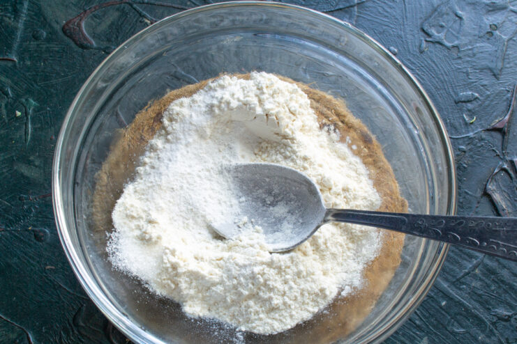 Preparing the dry ingredients Mixing all-purpose flour with sugar and salt in a glass bowl