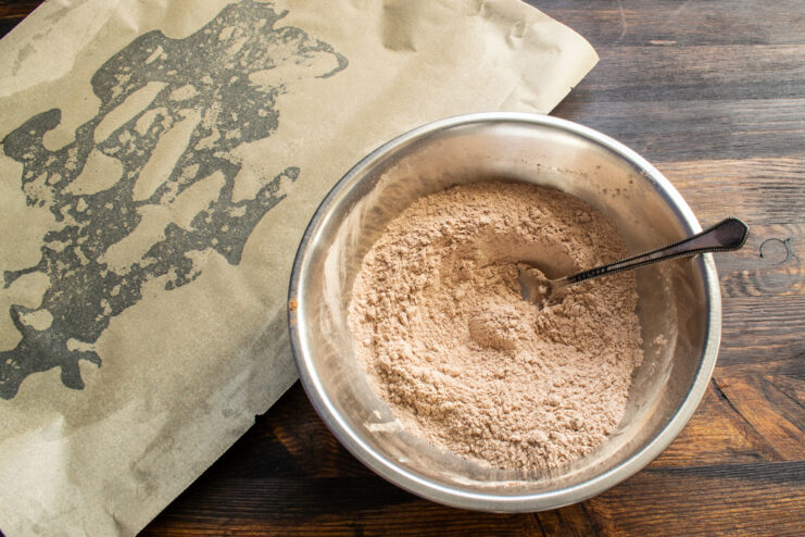 Mixing Dry Ingredients Whisking cocoa powder, flour, and cinnamon together in a bowl