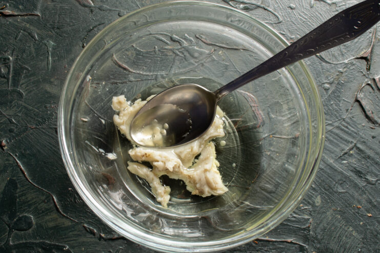 Preparing The Fat Base Mixing pork fat and vegetable oil together in a bowl