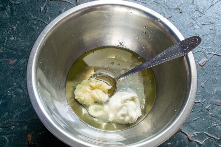Mixing the wet ingredients for the dough Wet ingredients mixed in a bowl for pie dough