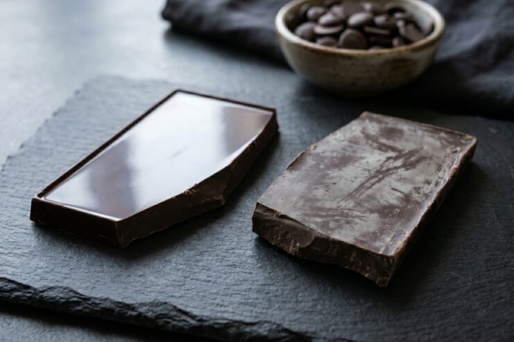 Difference Between Tempered and Bloomed Chocolate Comparing shiny tempered chocolate with matte bloomed chocolate