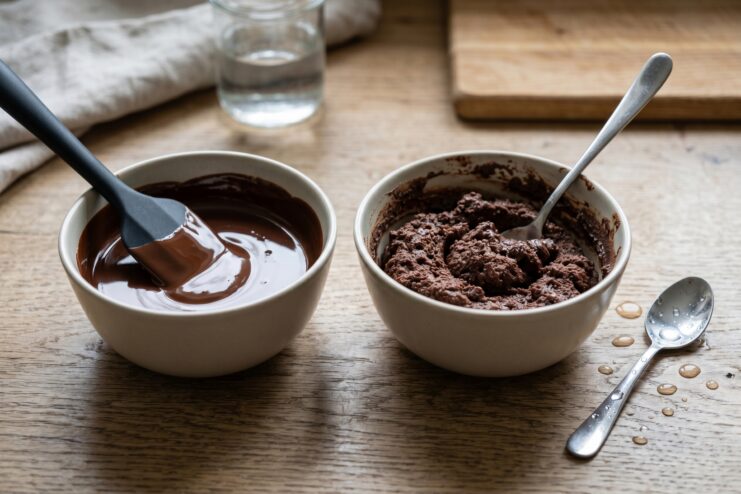 Consequences of Water in Chocolate Comparing smooth melted chocolate with chocolate that seized from water exposure