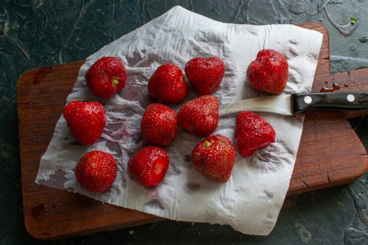 Preparing The Strawberries Freshly washed strawberries resting on a paper towel