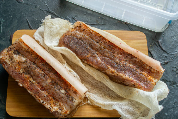 Pork Belly Coated in Paprika Dry-cured pork belly heavily coated in a mixture of smoked paprika and black pepper