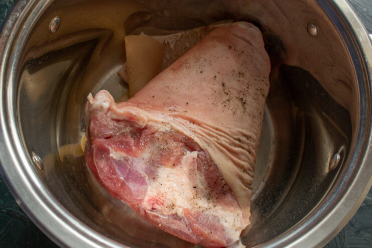 Preparing the Meat Pork hock and skin in a pot ready for cooking.