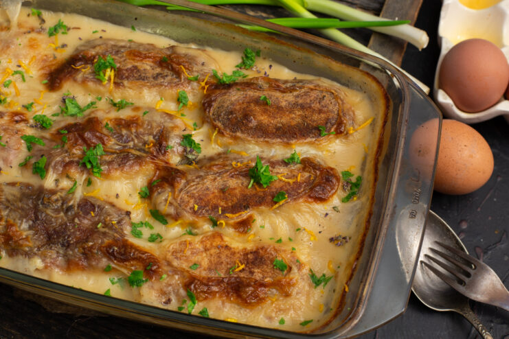Baked stuffed fish patties in a rich cream sauce