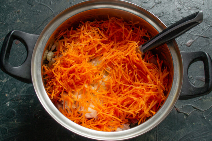 Vegetable base Grated carrots added to the pork and onion mixture