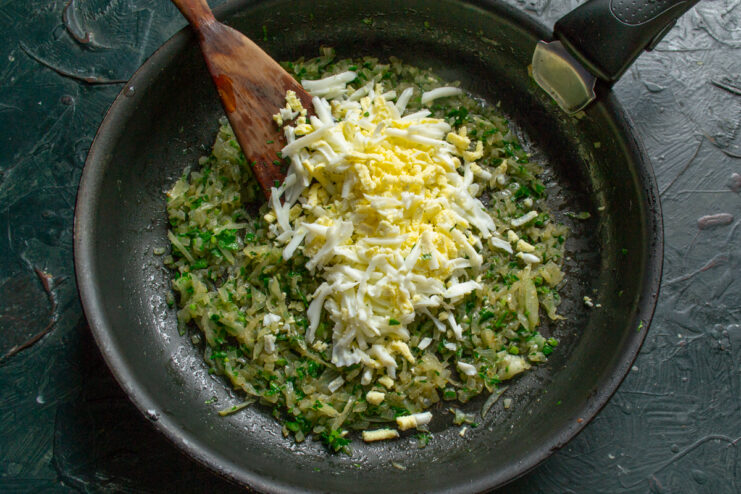 The Egg Filling Grated boiled eggs mixed with onions and herbs