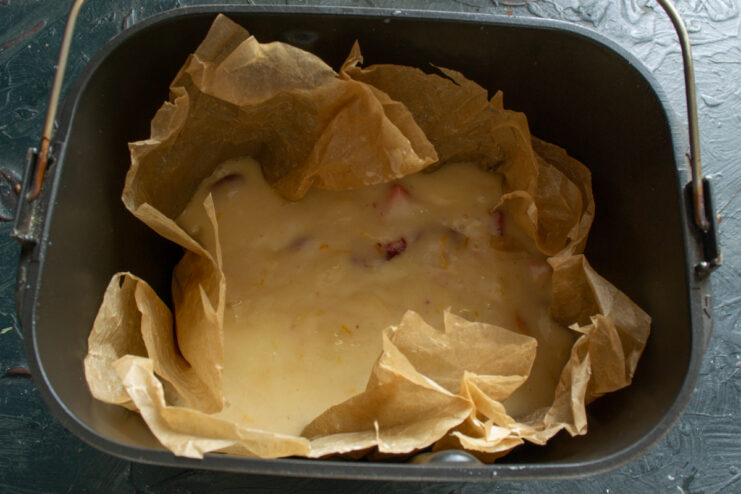 Preparing for baking Cake batter in a parchment-lined bread maker pan