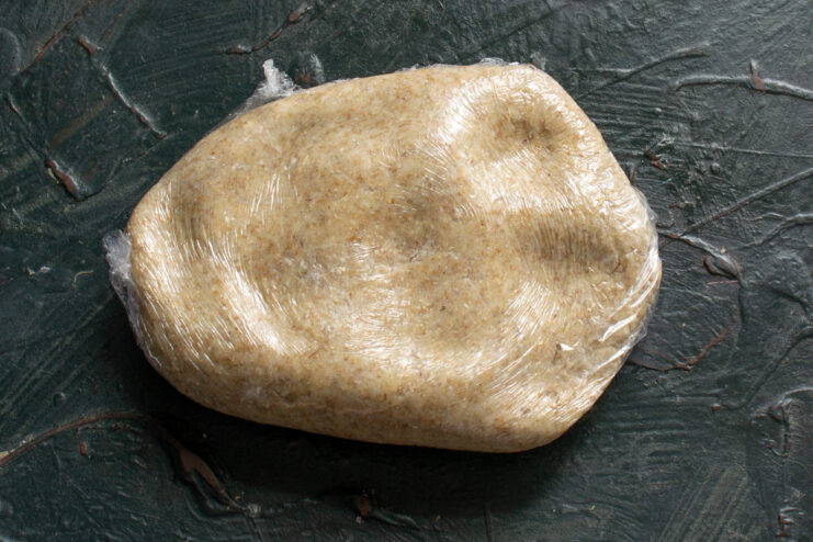 Resting the wrapped dough Rye dough tightly wrapped in plastic film resting on a table