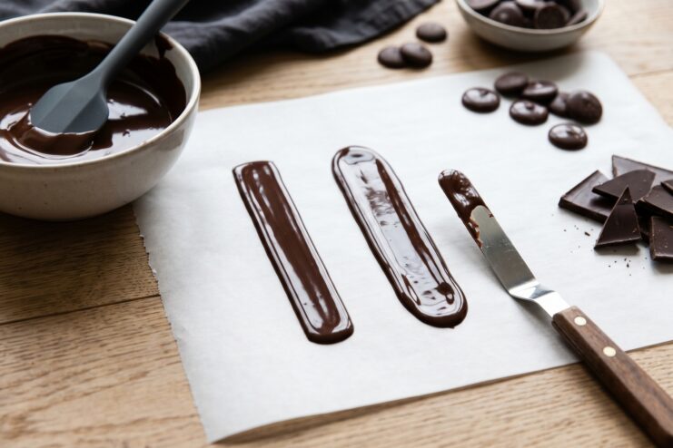 Testing Chocolate Readiness Test smears of chocolate on parchment paper to check crystallization