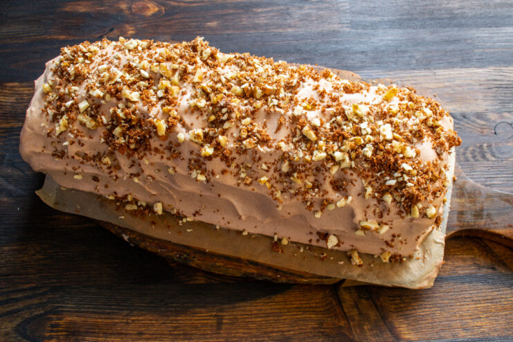 Decorating With Nuts Frosted chocolate cake dusted with chopped walnuts and crumbs