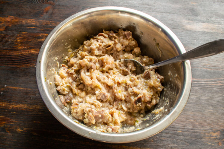 Finished Sausage Mixture Thoroughly mixed raw chicken sausage farce in a large bowl