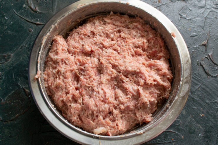 Finished ground meat Thoroughly mixed ground meat for sausages in a bowl