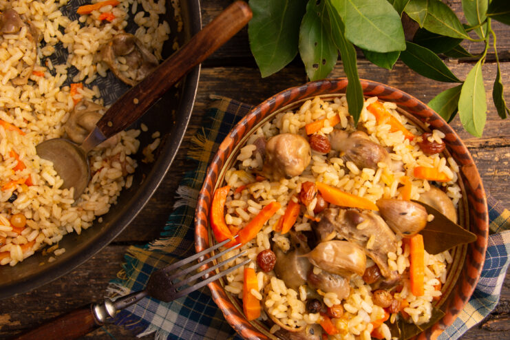 Turkish pilaf with chicken gizzards, raisins, and crunchy nuts in a dish