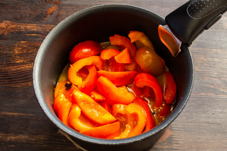 Simmering the peppers Peppers simmering in a covered saucepan with marinade
