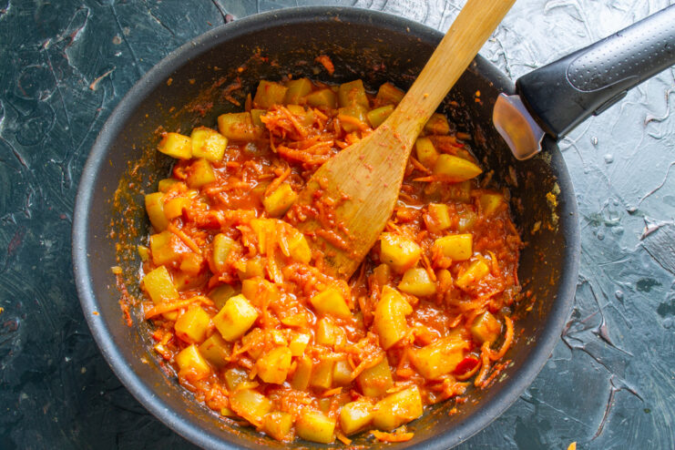 Zucchini sauté simmering uncovered in a pan