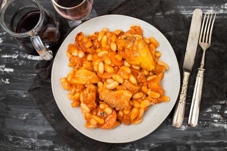 Hearty Porto-style tripe stew with white beans and smoked meats served in a bowl