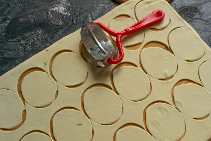 Cutting out dough circles with a special pastry cutter