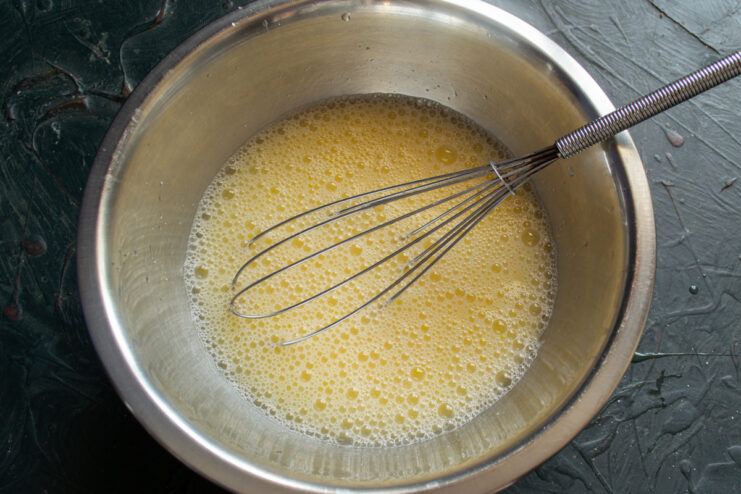Frothy whisked egg and whey mixture