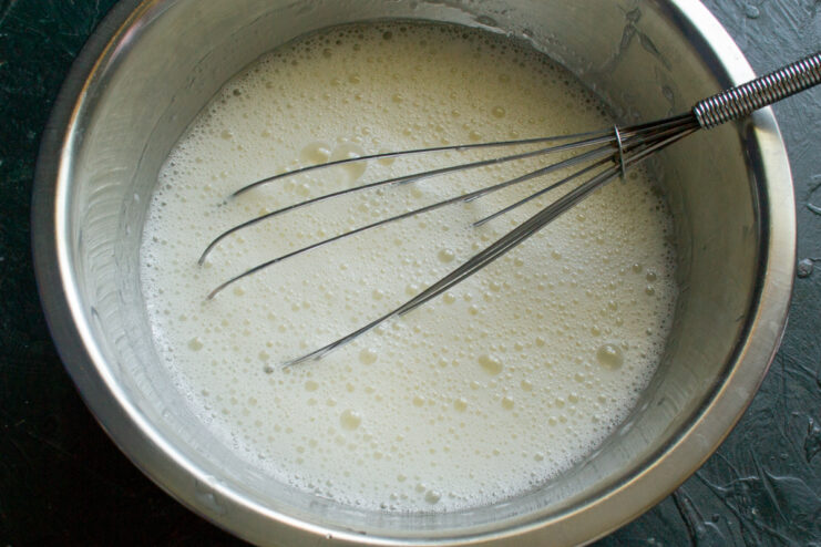 Whisking the base Smoothly whisked egg and milk mixture with a light foam