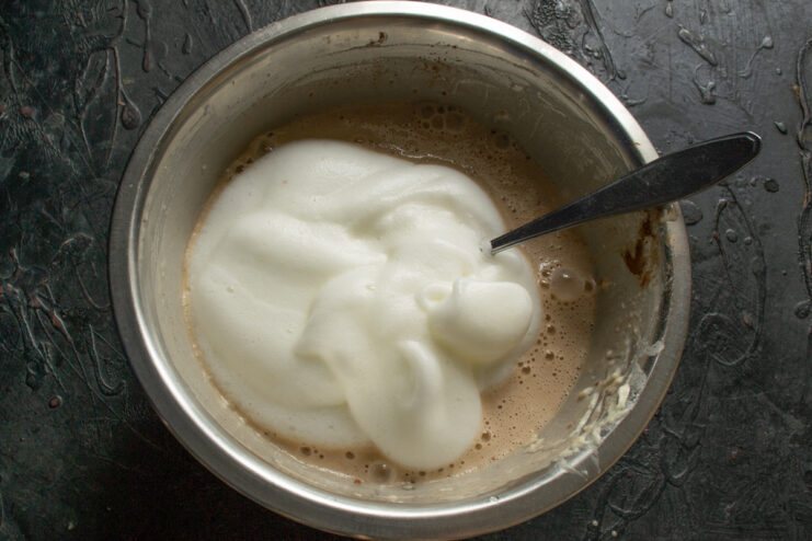 Whipping egg whites for airy crepes Fluffy whipped egg whites added to the chocolate batter