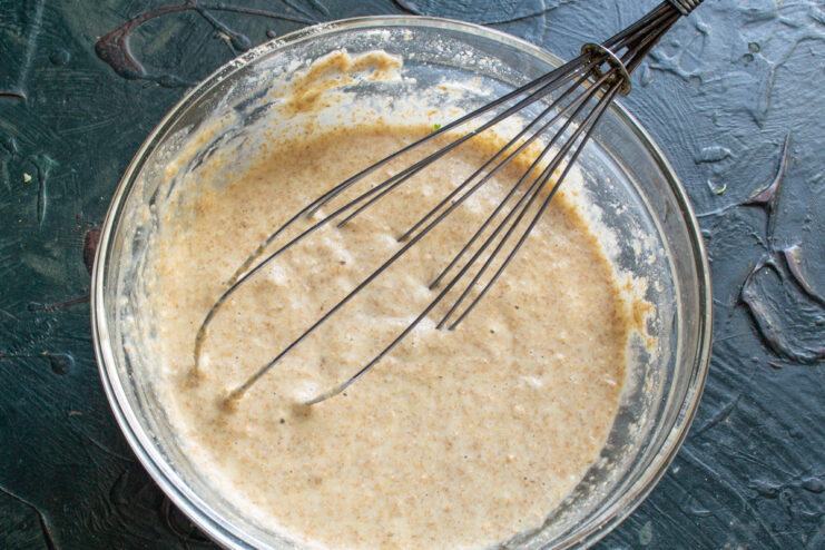 Whisking the batter Whisking the crepe batter smoothly in a glass bowl
