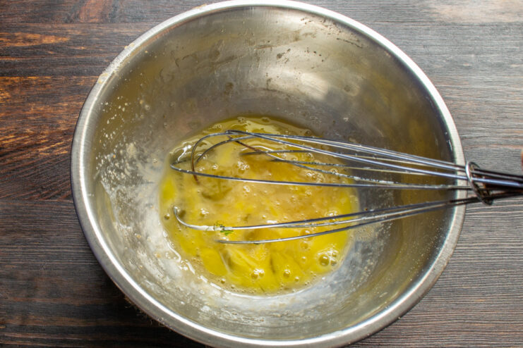 Whisking eggs in a metal bowl