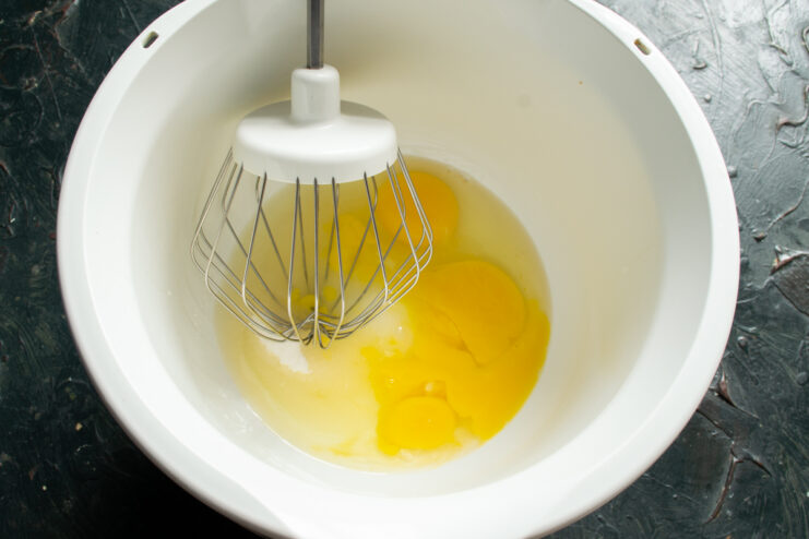 Eggs and sugar Eggs and granulated sugar in a stand mixer bowl ready for whisking