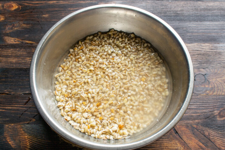 Soaking pearl barley Soaking pearl barley in a metal bowl filled with water