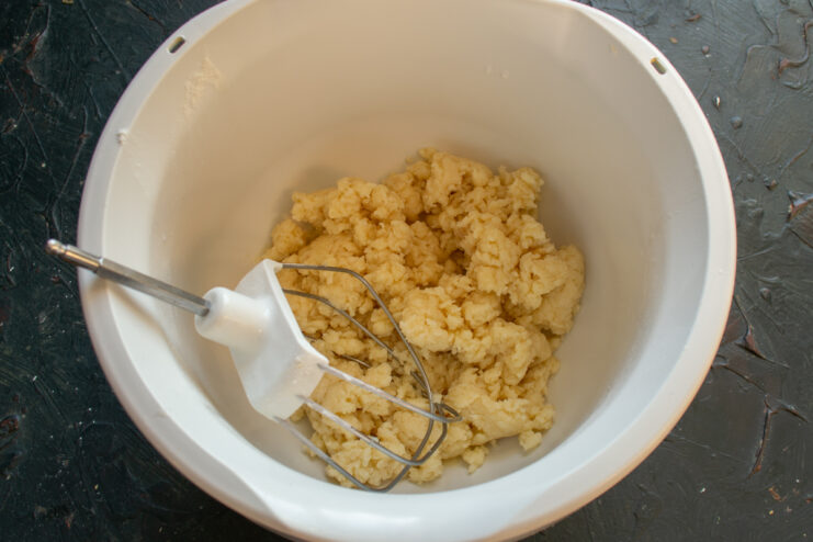 Textured kneaded dough resting in a mixing bowl
