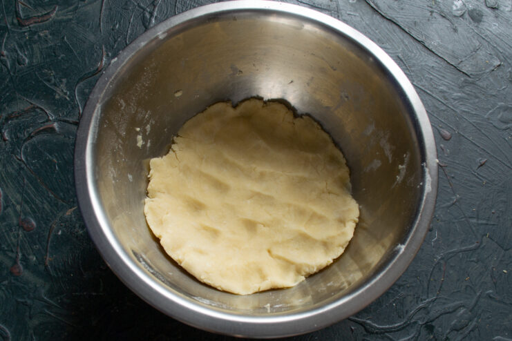 Ready Tartlet Dough Mixed shortcrust dough resting in a metal bowl