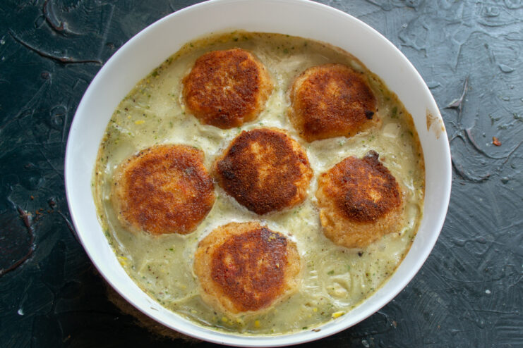 Baked fish meatballs in a casserole dish