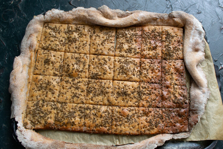 Baking in the oven Golden brown baked rye crispbread resting on a baking sheet