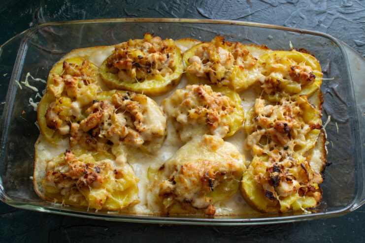 Final baking step Baking stuffed potatoes in a glass baking dish in the oven
